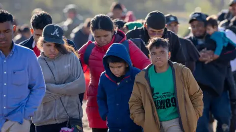 Getty Images Migrants in Eagle Pass, Texas on 18 December