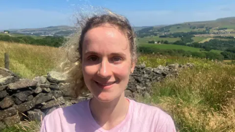 Photograph of Freya Bowden who is a masters student at the University of Manchester. She is pictured on Holcombe Moor above Ramsbottom.