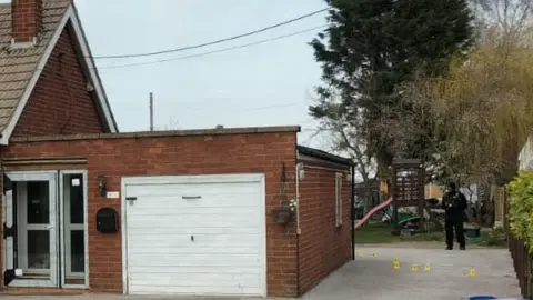 Police at the scene of a murder investigation in Lincolnshire