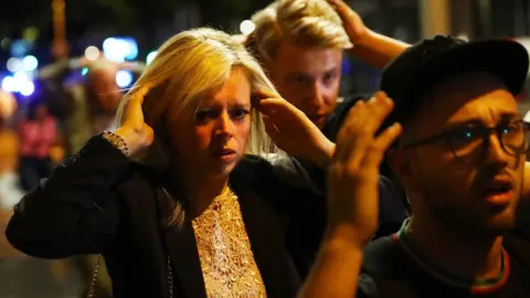 Reuters People with their hands on their heads in Borough Market