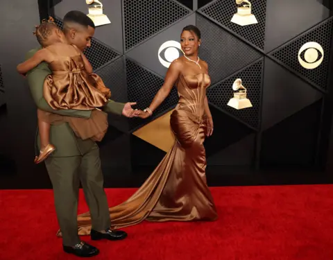 Reuters Victoria Monet and her partner and daughter at the Grammys