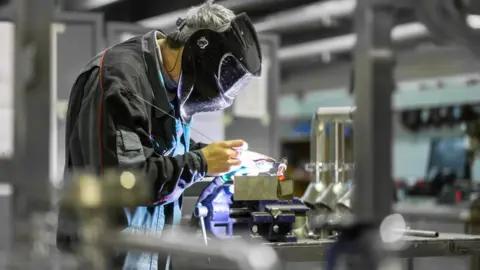 Getty Images Factory worker