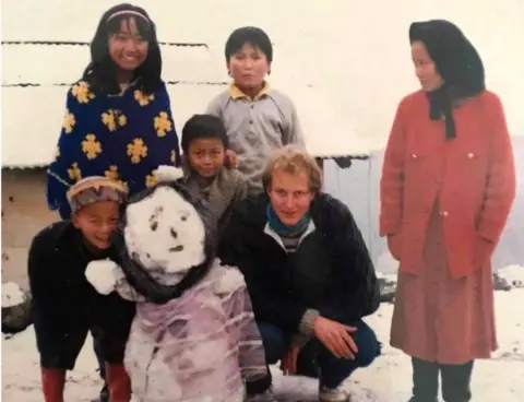 Reka Gawa Reka (wearing headband) with her family when she was growing up in the in the Himalaya foothills