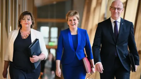 Getty Images Fiona Hyslop, Nicola Sturgeon and John Swinney