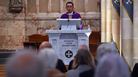 Getty Images Canon Gerald Sharkey at St Andrew's Cathedral in Glasgow