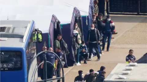 PA Media Migrants in specially erected tents in Dover