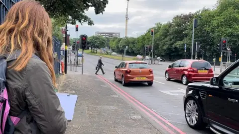Sarah Chaundler One of the volunteers monitors cars