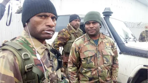 Scott Waide PNG troops wait to be sent to the quake zone