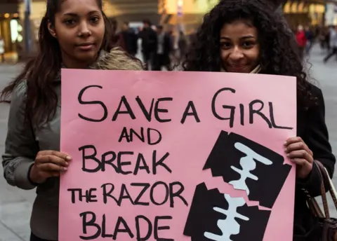 Getty Images Women protest against FGM.