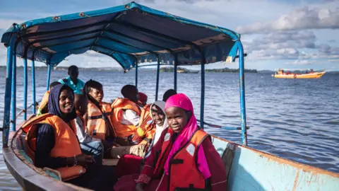 AFP Girls on a boat on Lake Victoria, Uganda - Monday 2 May 2022