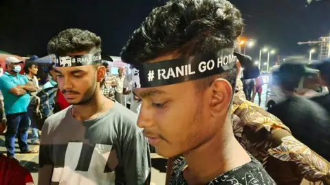 BBC Tamil People wearing Ranil Go Home headbands