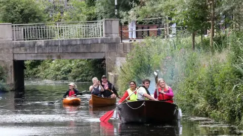 Getty Images The baton makes its way through Maidenhead by boat