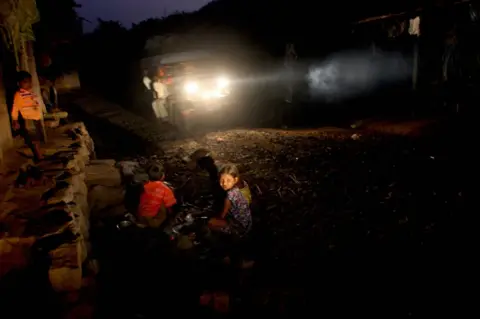 AFP Indian children play outside their home in the tribal hamlet of Wada, in Thane on the outskirts of Mumbai on November 18 2007.