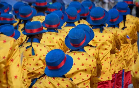 AFP Members of minstrel troupes sing and dance as they march through the city centre during the annual Tweede Nuwe Jaar (Second New Year) Cape Town Minstrels Carnival on January 2, 2019, in Cape Town.