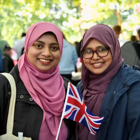 Shazmiya Firdaus (left) and Salamath Silmy Trooping the Colour