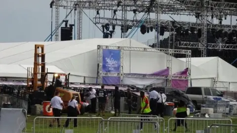 Reuters Crew attend to fallen metal structure at Backstreet Boys concert in Thackerville, Oklahoma, US on 18 August 2018