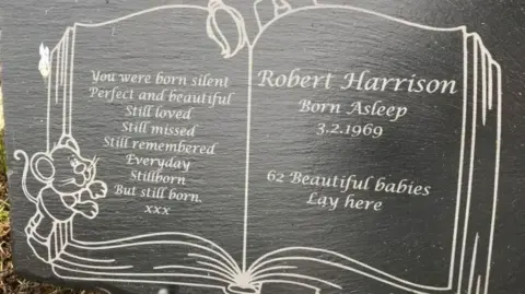 A headstone to Robert Harrsion 'born asleep 3.2.1969'.