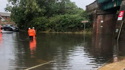 Bailey Moules A flooded roadworthy  underneath a obstruction   span  astatine  Cooden Beach station.