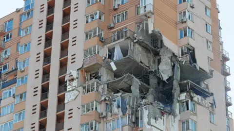Reuters A view shows an apartment building damaged by recent shelling in Kyiv, Ukraine