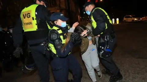 EPA Woman being arrested in Bristol