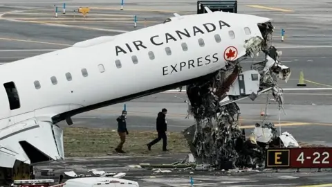 Reuters The Air Canada plane with debris beneath the nose