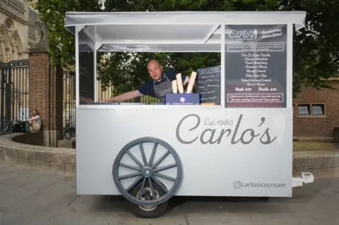 BBC Nick Caporaso behind his vending trailer in Cambridge