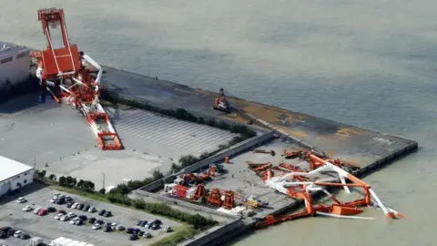 Reuters Damaged cranes in Nishinomiya