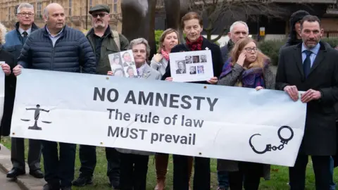 PA Media/Stefan Rousseau Victims of the Troubles have held several protests against the proposed law