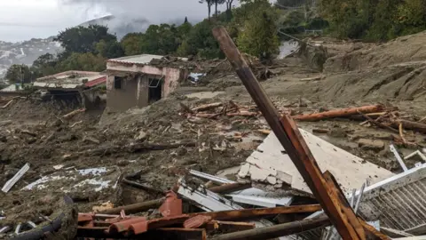 EPA Damage wreaked by the mudslide, including destroyed houses