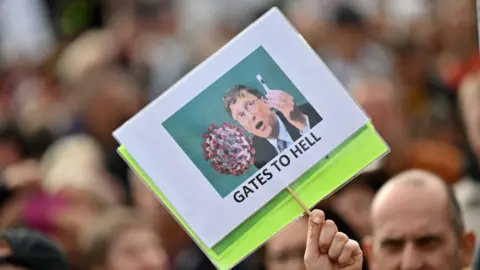 Getty Images Poster featuring Bill Gates and a vaccine from anti-lockdown protests