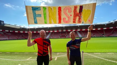 Le Tour de Premier League Chris Scott and Shaun Spence at the finish line