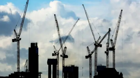 PA Media A general view of construction cranes on the London skyline