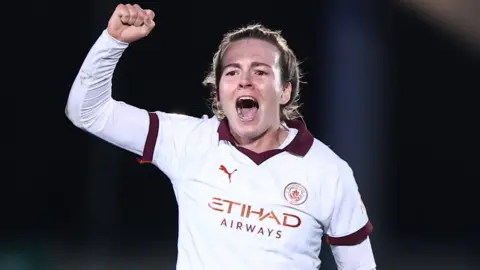 Lauren Hemp celebrates