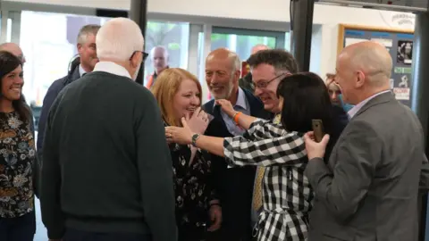 Liam McBurney/PA Naomi Long celebrations