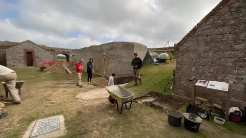 Volunteers excavating the roman wall site