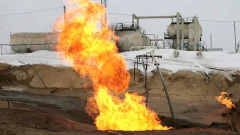 Getty Images Gas flame near Rosneft gas producing station