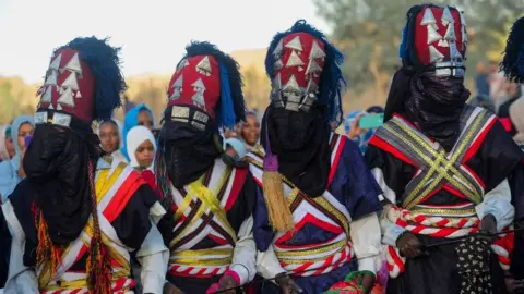 AFP Men in traditional Algerian clothing, 29 July 2023