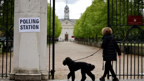 Getty Images Woman heads to polling station