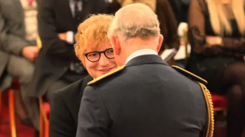 PA Ed Sheeran MBE with Prince Charles