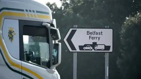 Getty Images A lorry passes a sign in Liverpool for the ferry to Belfast