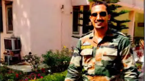 US Justice Department Vikash Yadav wearing a combat uniform