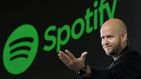 Getty Images Daniel Ek, CEO of Swedish music streaming service Spotify, gestures as he makes a speech at a press conference in Tokyo on September 29, 2016.