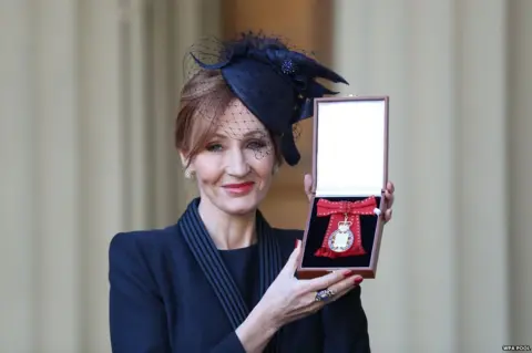 WPA Pool J. K. Rowling posing with her Companion of Honour medal, which she won this week.