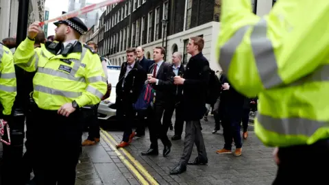 AFP Workers are evacuated from offices