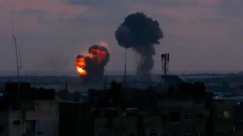 AFP An explosion in Rafah, Gaza, after Israeli air strikes on 20 June 2018