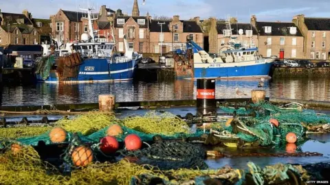 Getty Images Fishing boats in Peterhead harbour