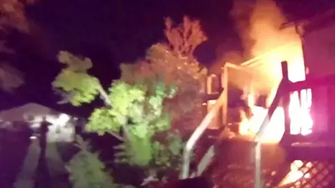 Fire on the porch of a house