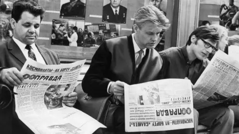 Sovfoto Muscovites reading the latest news of the Soyuz 11 mission. Moscow, USSR. June 10, 1971.