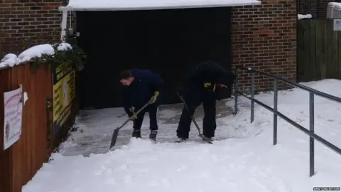 Andy Rushton Staff clearing the entrance to the ski centre