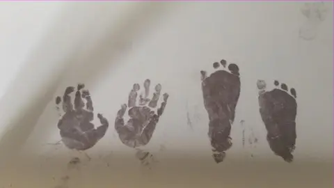 Kellie Cunningham Henry's hands and feet prints